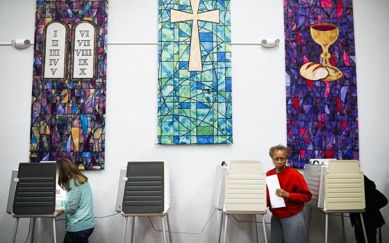 Voters fill out ballots at a polling place inside the Pleasant Ridge Presbyterian Church on Election Day, Nov. 8, 2016, in Cincinnati. (RNS/AP/John Minchillo)