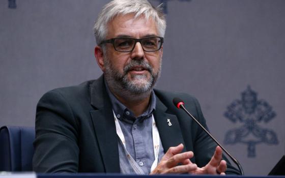 Belgian Deacon Geert De Cubber, a member of the Synod of Bishops on synodality, speaks during a news conference at the Vatican Oct. 9. He told reporters that delegates are discussing women deacons, even though the Vatican's doctrine chief has said that the time is not ripe to pursue women deacons. (CNS/Justin McLellan)